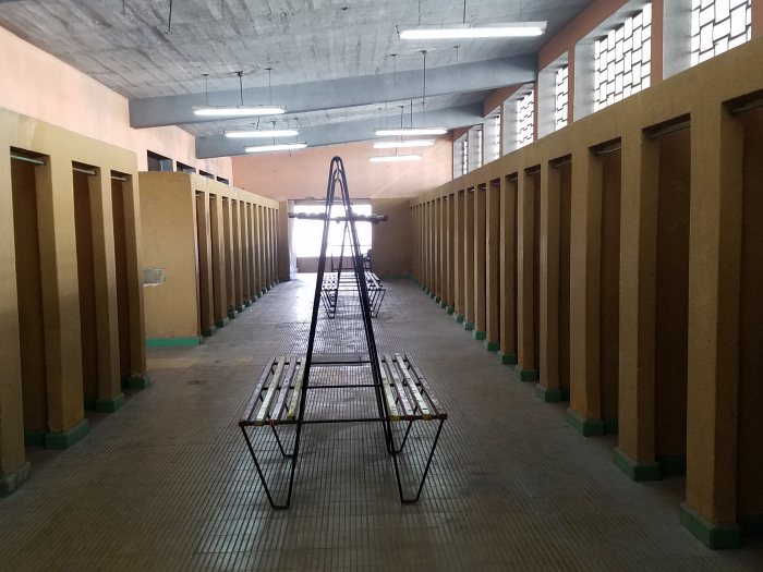 bench and stalls with tiled floor